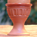 

   Glazed terracotta egg cups   
   from Onevillage.com

   Oko egg cup
   One Oko India

