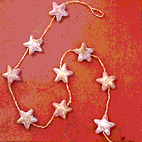 

   11319 String of stars
   
   In all, 15 terracotta stars   
   on a metre-long string of
   tiny terracotta beads

   Click picture to next product   

