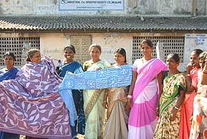 

   Batik-makers' cooperative members,   
   outside their workshops   


