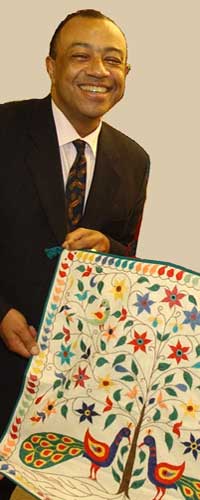 

   Paul Boateng MP
   Chief secretary to the Treasury   
   with 08851 Fruit of love
   cushion cover   
 
