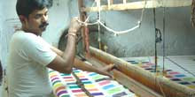 

   Weaver at his loom   
.
