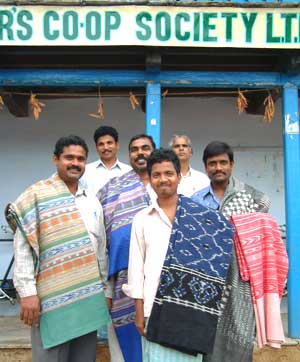 

   Co-op members with   
   Onevillage.com ikat
   outside the headquarters   
.
