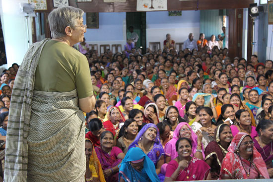 

   St Mary's Mahila Shikshan Kendra   
   members listening to celebration address   
   with founder Sister Lucia in foreground
.
