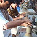 

   Oko potters
   at the wheels      

