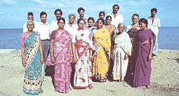 

   Members of the
   Swallows Cooperative Society   
   on the beach opposite their
   workshops in Chennai

